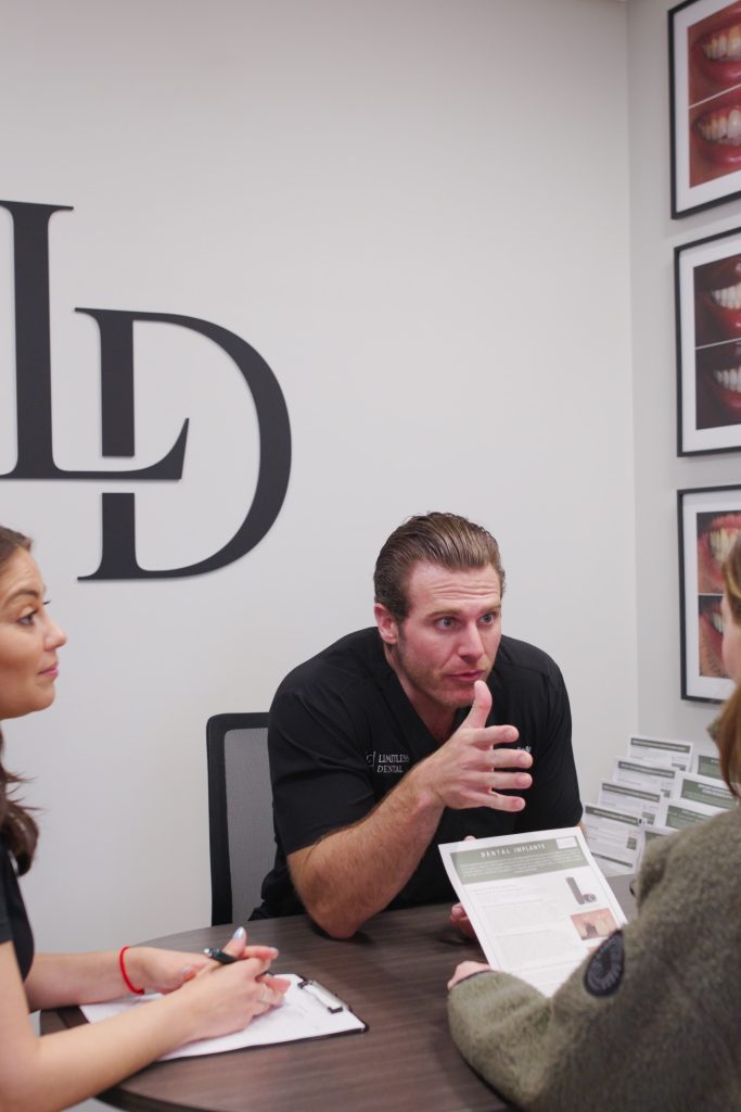 Dr. Nick Ciardiello of Limitless Dental in Jersey City consulting with a new patient at their first dental appointment