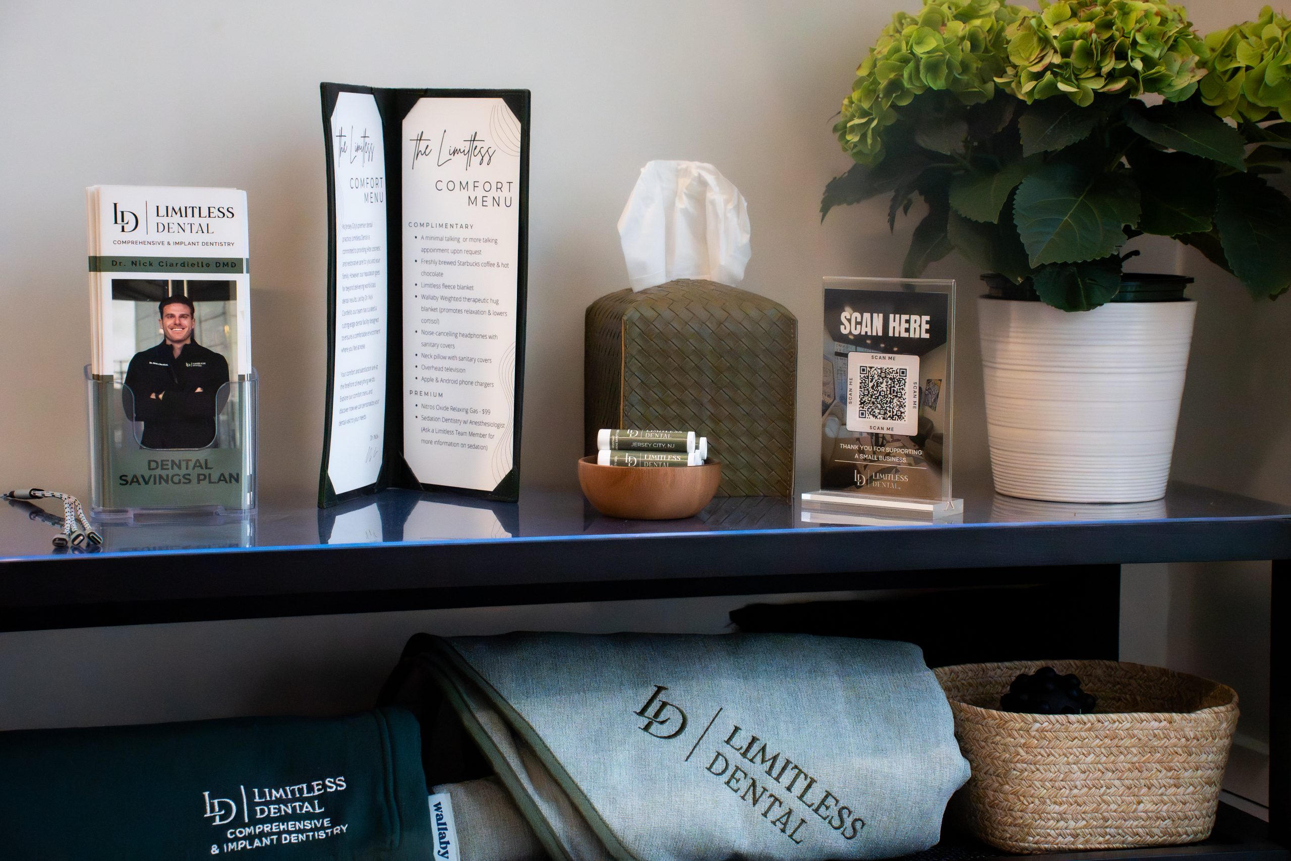 Comfort menu display at Limitless Dental in Jersey City showing amenities available to Invisalign and general dental patients during appointments.